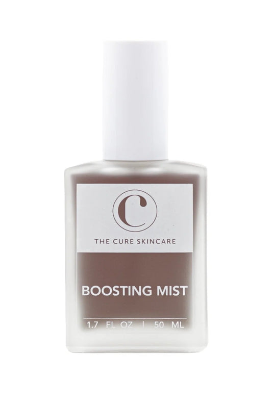 Skincare boosting mist bottle with 'The Cure Skincare' branding on a white background