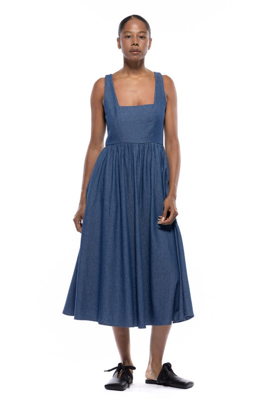 Woman wearing a blue dress on a white background