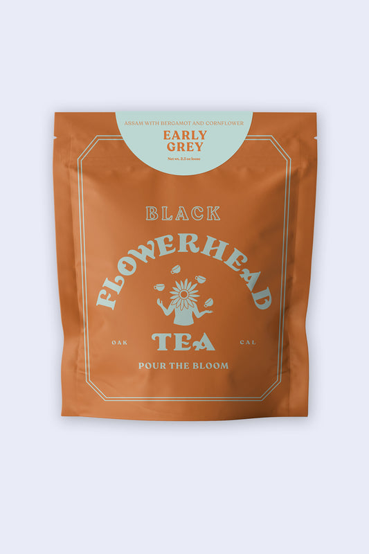 Packaging of Flowerhead Early Grey black tea, featuring a brown paper bag with branding and product name.
