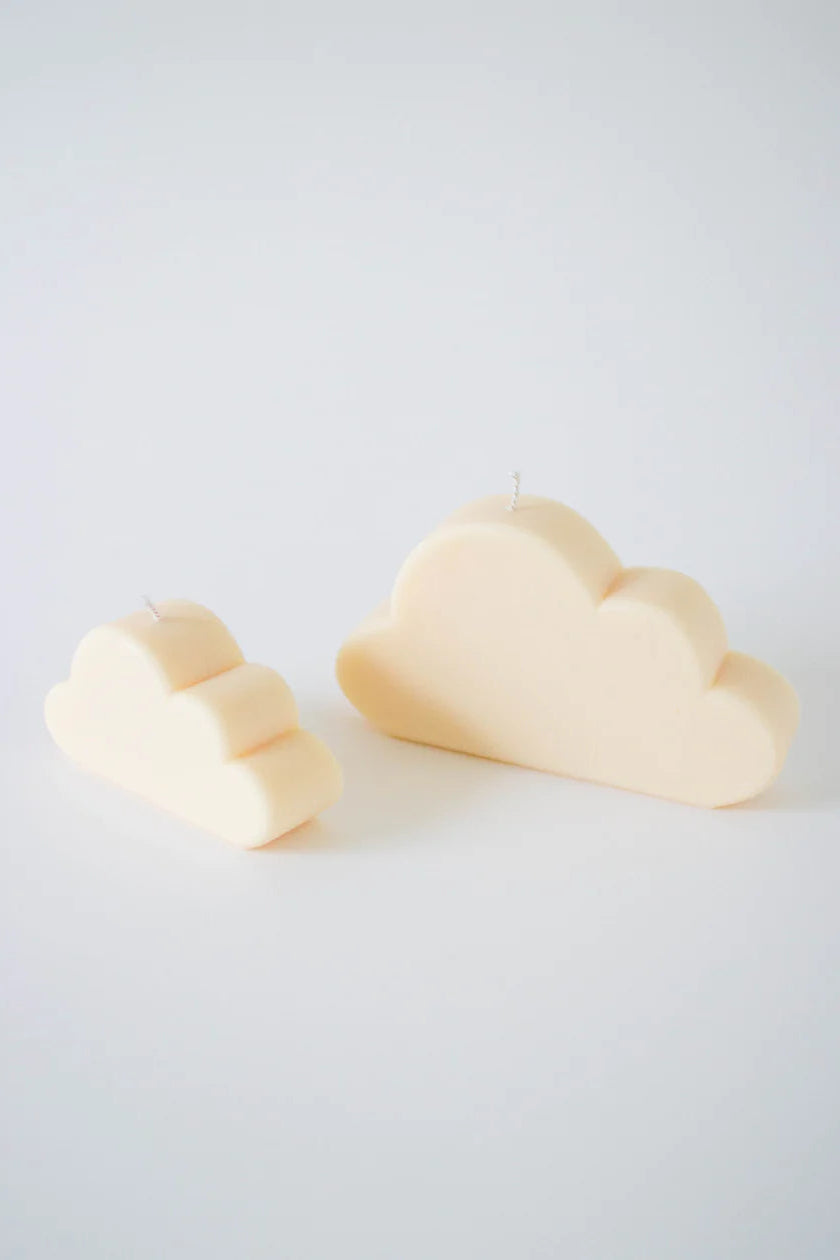 Two cloud-shaped candles, one with a lighter color and one with a darker color, placed on a light background.