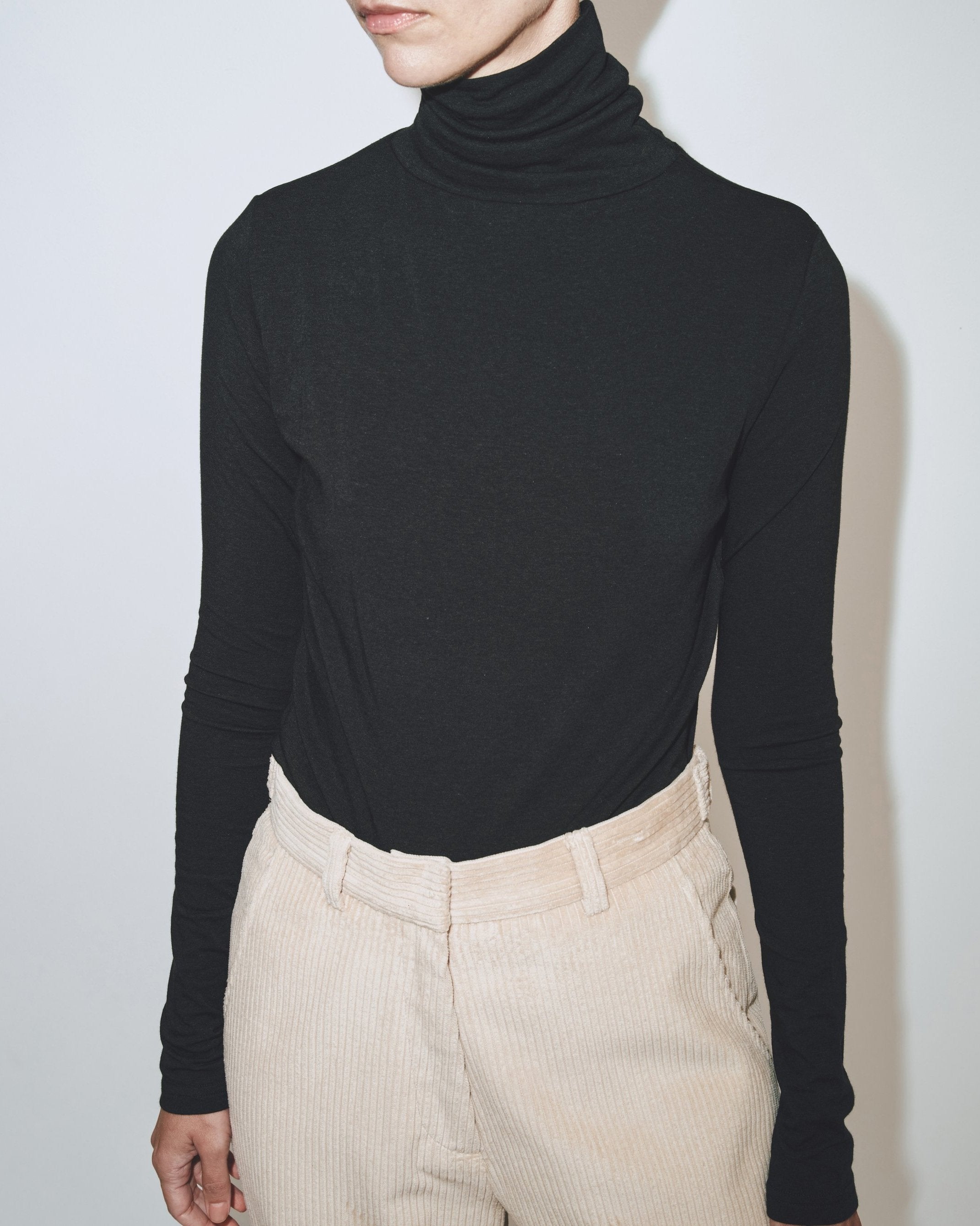 Black roll neck top best sale