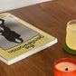 natural scented soy candle hand poured in amber glass on table in lifestyle shoot