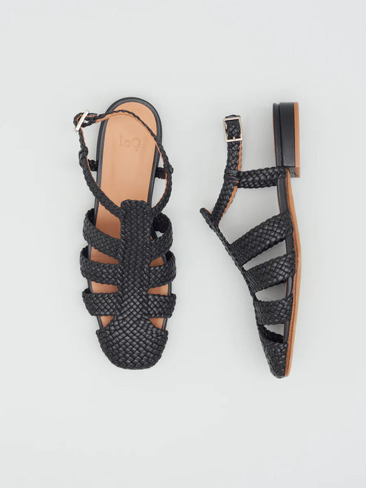 updated Fisherman sandal with buckle closure & three straps across the foot in woven black leather.