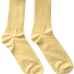 Pair of yellow socks on a white background