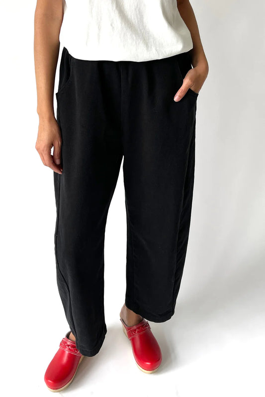 black canvas pants arc pants with elastic waist, curved leg, side seam panels and deep pockets