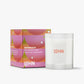 White candle with 'LOHN' branding next to its packaging on a white background