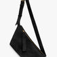 Black suede shoulder bag with a strap amd gold buckle on a white background