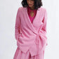 Woman wearing the Blythe Blazer in bubblegum linen-cotton blend by Eliza Faulkner — ethical spring suiting at Ånde slow fashion store