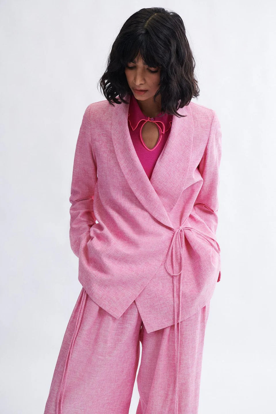 Woman wearing the Blythe Blazer in bubblegum linen-cotton blend by Eliza Faulkner — ethical spring suiting at Ånde slow fashion store