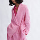 
Close-up of crossover shawl collar on the Blythe Blazer in bubblegum by Eliza Faulkner — sustainable women's blazers at Ånde