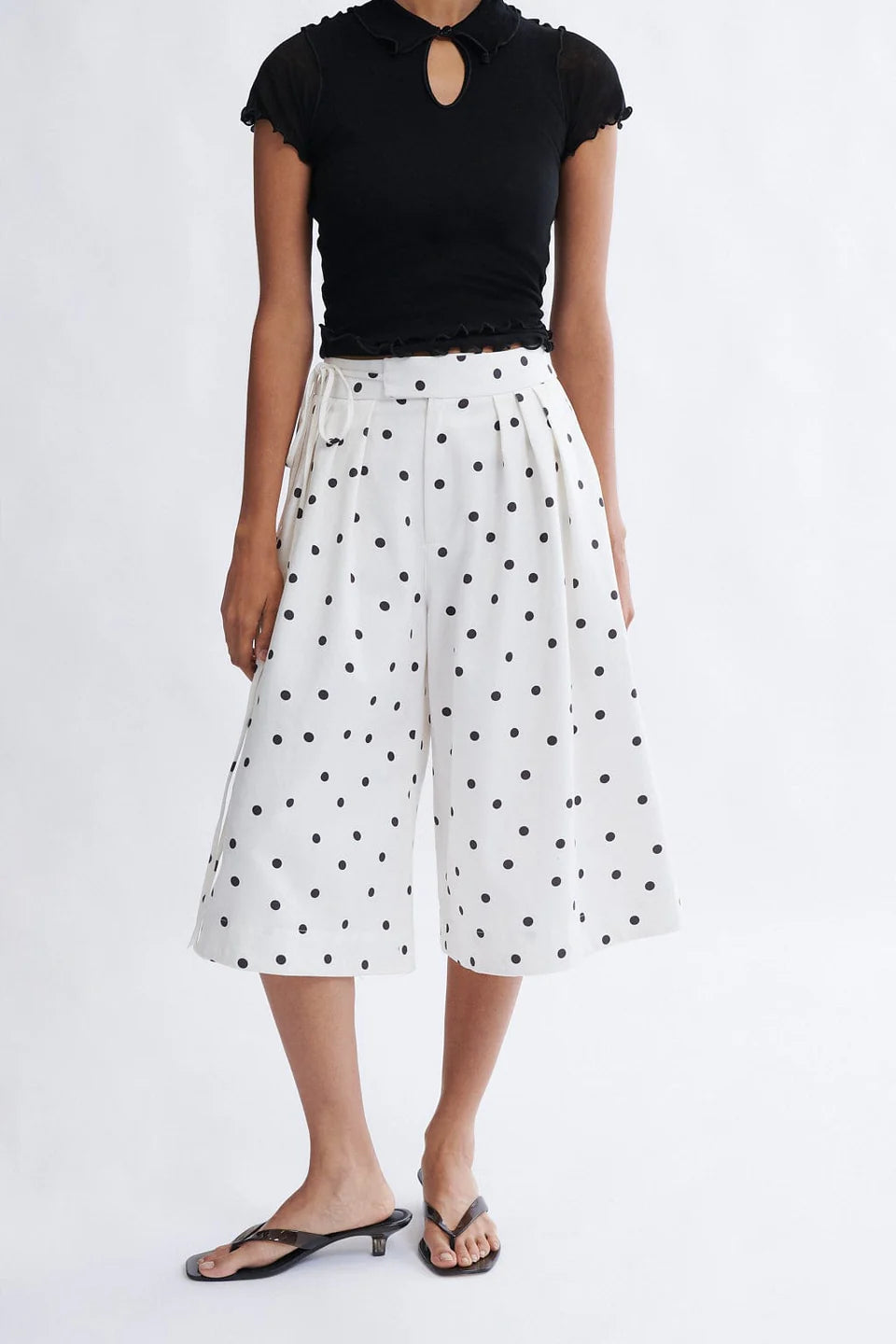 Woman wearing the Frances Short in cookies and cream polka dot tencel twill by Eliza Faulkner — ethical women's shorts at Ånde slow fashion store