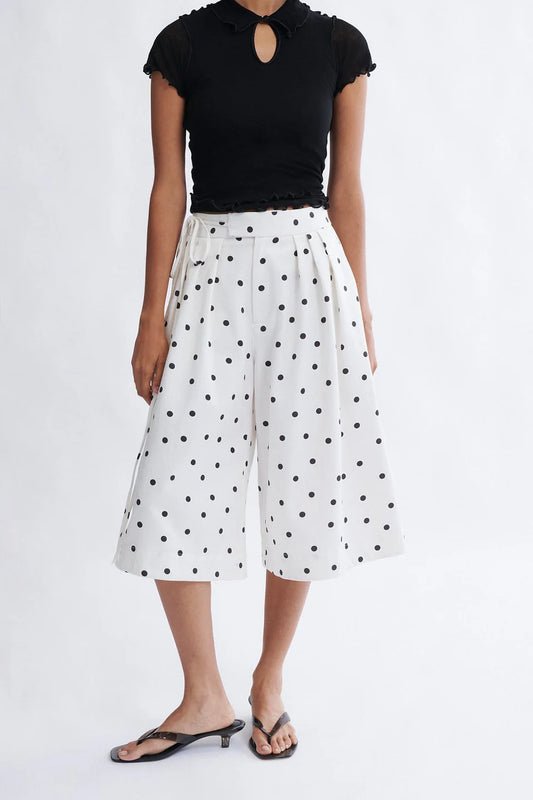Woman wearing the Frances Short in cookies and cream polka dot tencel twill by Eliza Faulkner — ethical women's shorts at Ånde slow fashion store