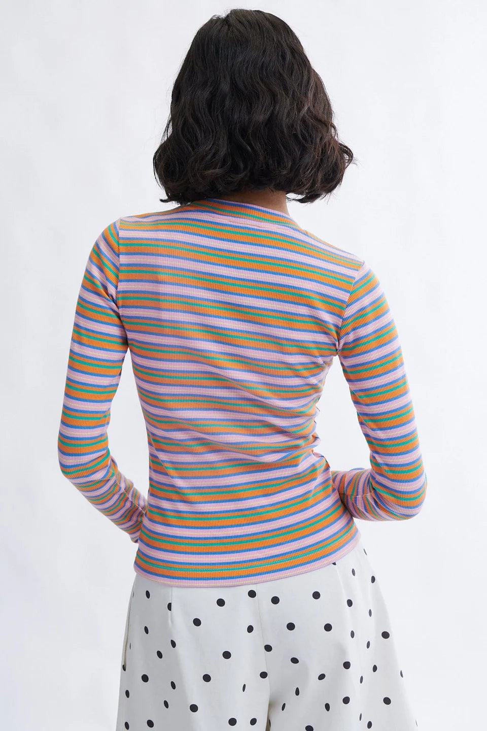 
Jamie long sleeve crew neck rib knit top in pink stripe styled with trousers by Eliza Faulkner at Ånde slow fashion store