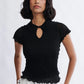 Woman wearing the Percy Polo Top in black by Eliza Faulkner — double-layered lyocell wool blend, ethically made in Canada at Ånde
