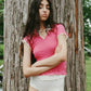 
Percy Polo Top in raspberry styled as a layering piece by Eliza Faulkner — sustainable women's fashion at Ånde