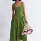 Woman wearing the Vivienne Linen Midi Dress in Meadow green by Eliza Faulkner, available at Ånde sustainable women's fashion store