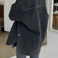 Back view of Le Bon Shoppe Theo Jacket in black denim showing rounded hem, yoke seam detail and oversized silhouette, styled with dark ribbed knit trousers