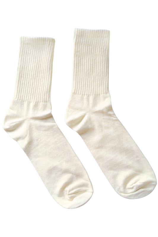 Pair of white socks with bow details on a white background